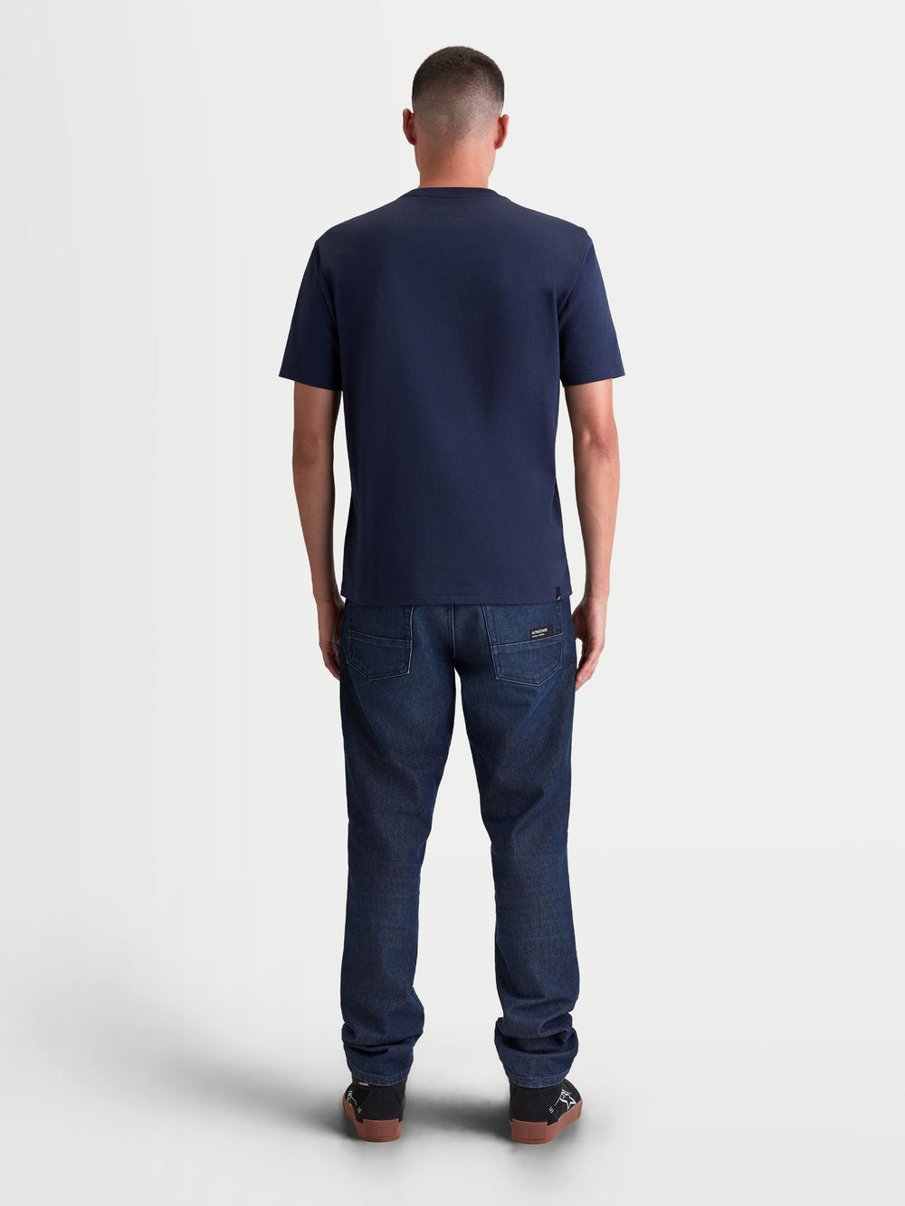 Alpinestars Ageless 2.0 CSF Tee, Men's Sportswear Short Sleeve T-Shirt, Navy Blue, rear view on-model showing the structured cut-and-sew fit and premium cotton-poly blend construction for everyday casual wear.
