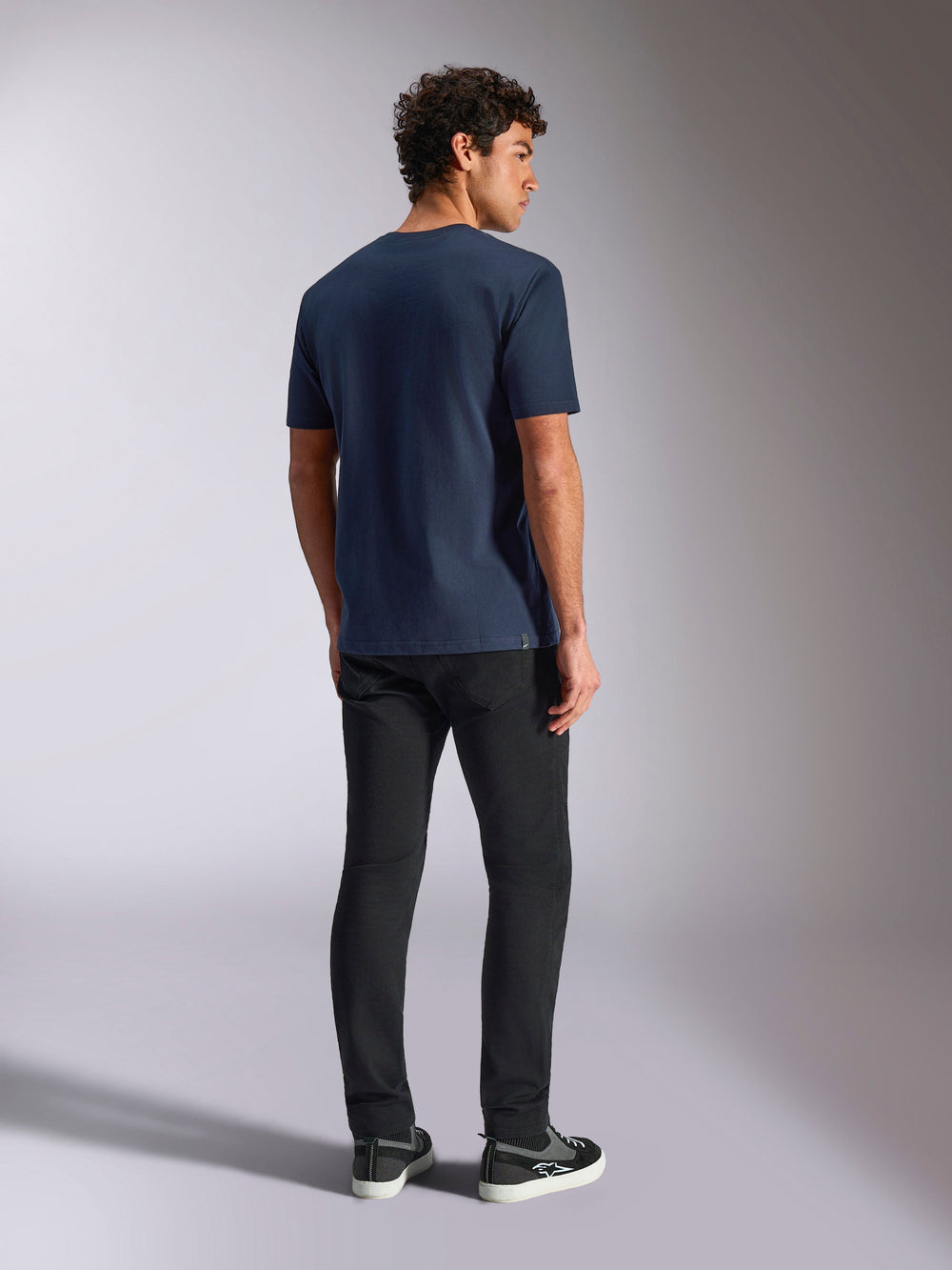 Alpinestars MX Helmet CSF Tee, Short Sleeve T-Shirt, Navy, back view on model, casual motorsport-inspired sportswear, worn with black pants and sneakers
