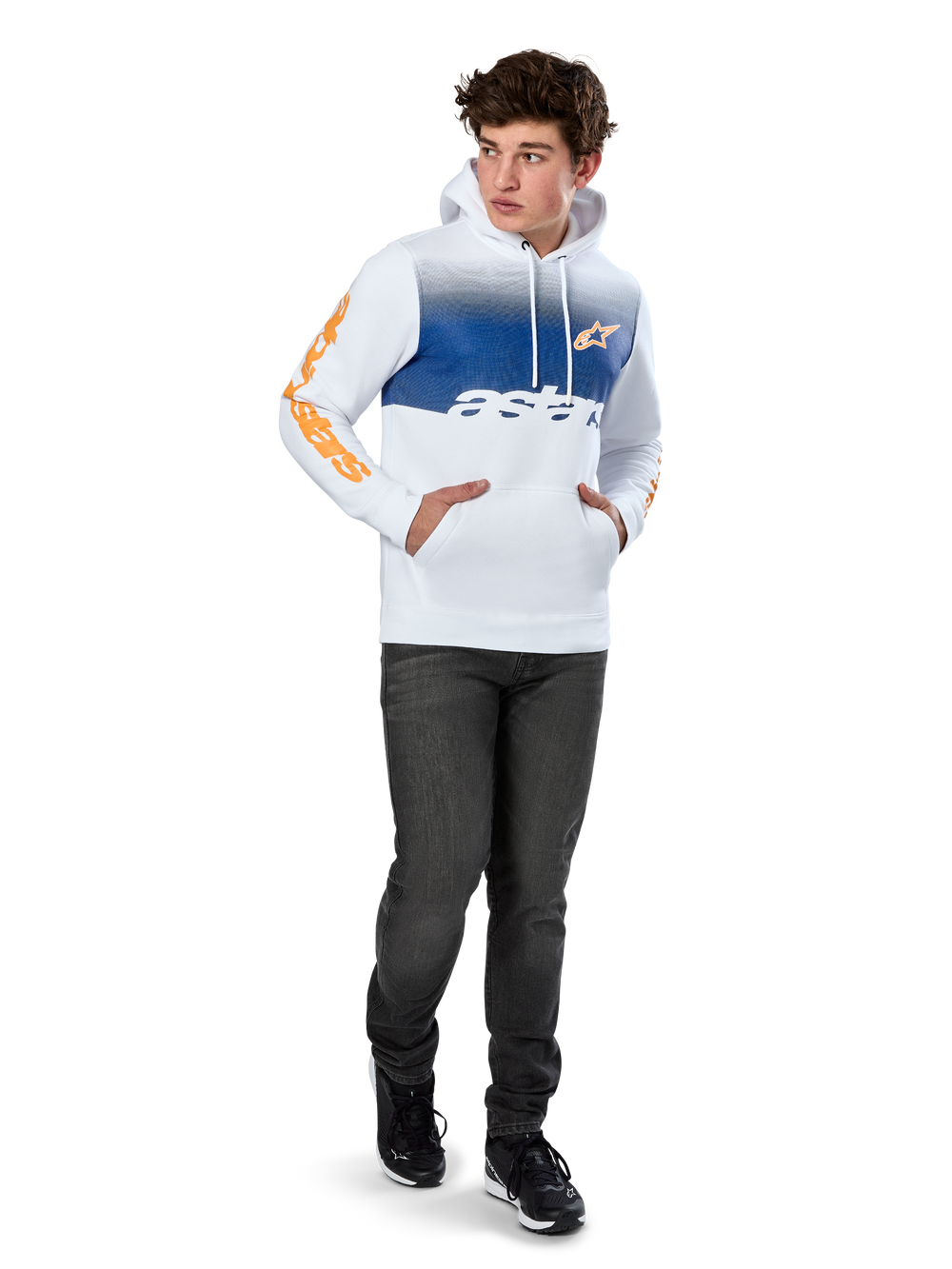 Alpinestars Specter Hoodie, White pullover fleece with blue gradation fade print, orange HD front logo and sleeve wordmarks, featuring a kangaroo pocket and drawstring hood, worn with dark jeans for a casual motorsport-inspired look
