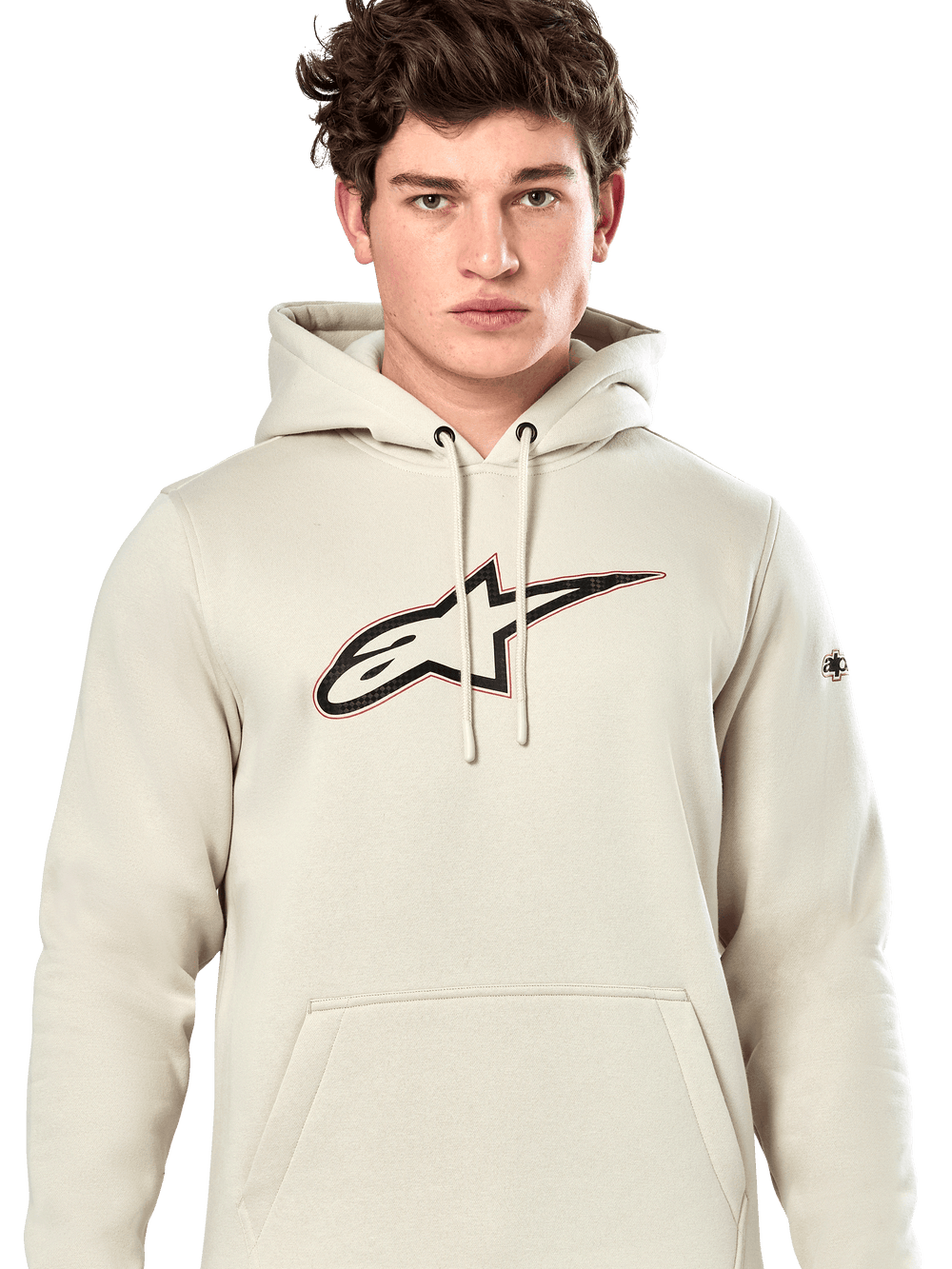 Alpinestars Insignia Hoodie, casual pullover sweatshirt, Off White with carbon fiber look logo on chest, red outline detail, drawstring hood and kangaroo pocket, worn by model, motorsport-inspired design