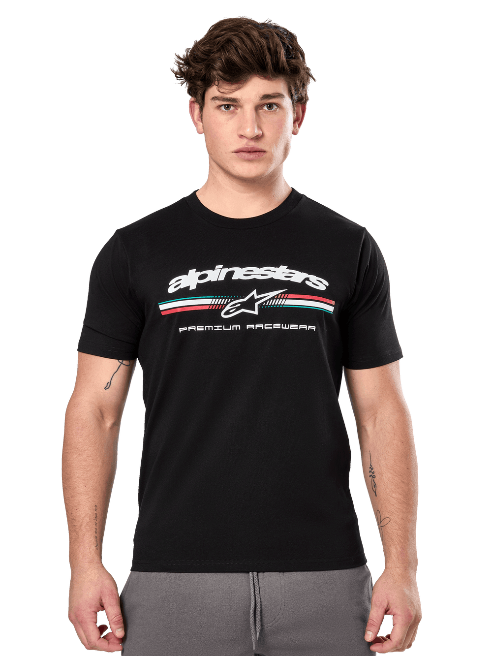 Alpinestars Prevail CSF Tee, Black Short Sleeve T-Shirt worn by a model, featuring white branding with a tri-color stripe and 