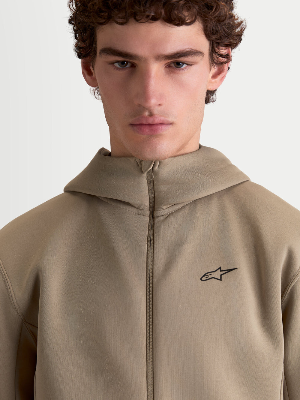 Alpinestars Cypher Hoodie, Sportswear Full-Zip Fleece for Men and Women, Putty Beige, featuring a high-neck hood, technical tri-blend double-face fabric, and a minimalist Alpinestars logo on the chest.