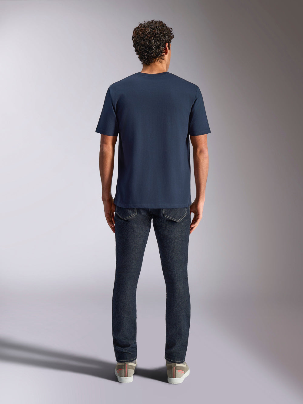 Alpinestars Trifecta CSF Tee, Short Sleeve T-Shirt, Navy Blue, back view on model, paired with dark denim jeans and casual sneakers, casual motorsport streetwear