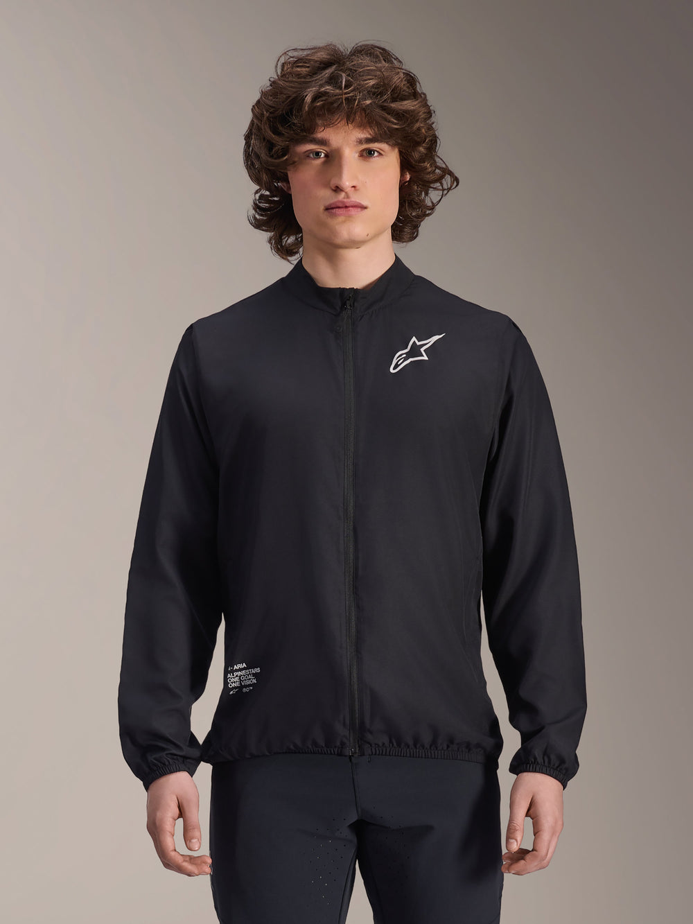 Alpinestars A-Aria Windbreaker Jacket, Black, Lightweight Cycling Jacket, featuring white Astars logo on chest and branding on lower right, full-zip front, mock neck, elastic cuffs and hem, performance fit for outdoor sports