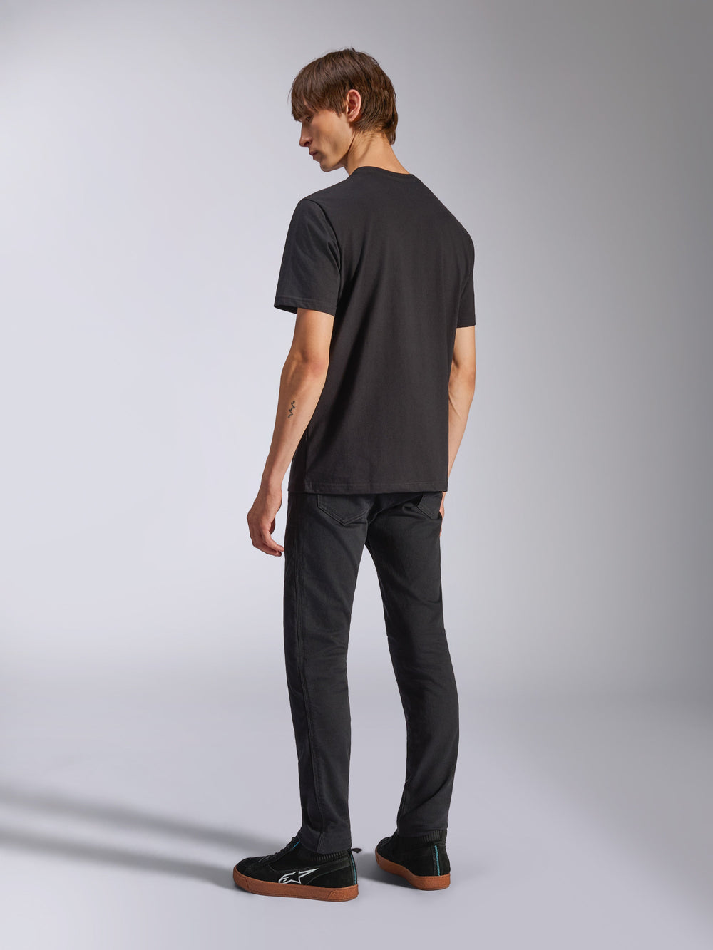 Alpinestars Harken CSF Tee, Short Sleeve T-Shirt, Black, back view on model, worn with black pants and black sneakers, casual motorsport streetwear
