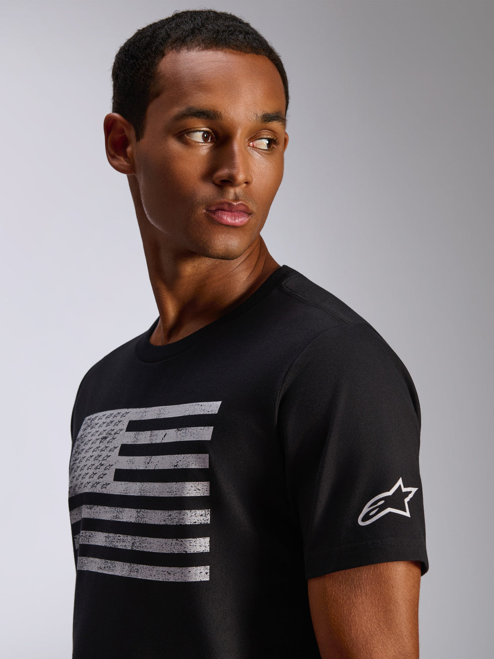Alpinestars Waving CSF Tee, Short Sleeve T-Shirt, Black, distressed flag graphic with integrated logos on chest, white Astar logo on sleeve, casual motorsport streetwear