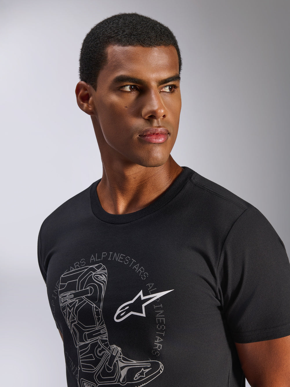 Alpinestars Tech Boot CSF T-Shirt, black casual sportswear tee with grey boot graphic, on a male model.