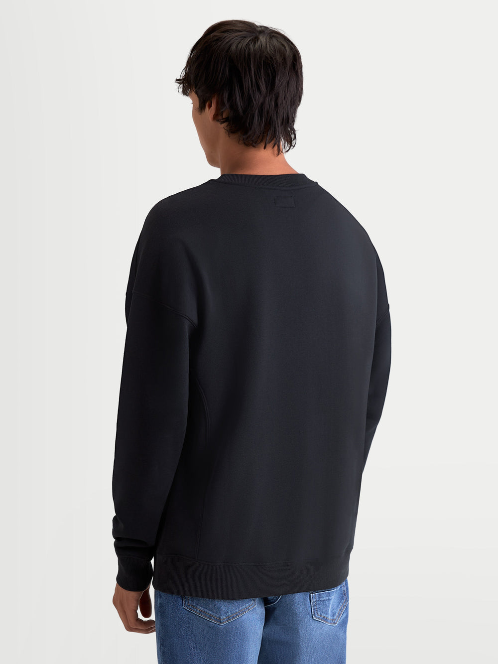 Alpinestars Guise Oversized Crew, Men's Sportswear Fleece Pullover, Black, Cotton and Recycled Polyester, Rear View Showing Relaxed Oversized Fit and Ribbed Hem