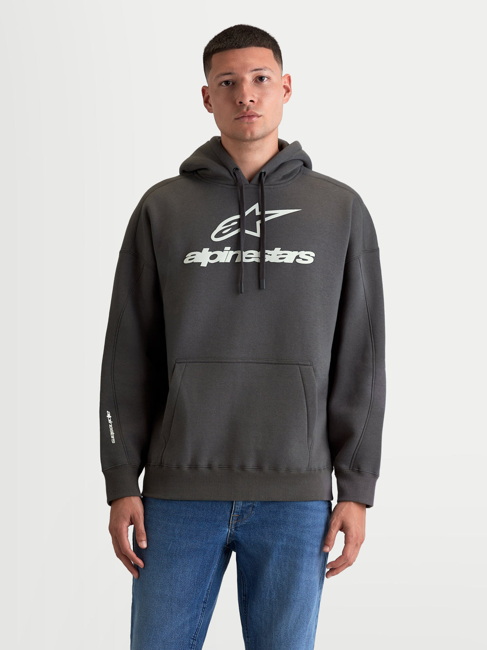 Alpinestars Prelude Oversized Hoodie, Men's Sportswear Fleece Pullover, Charcoal Gray and White, Cotton and Recycled Polyester, features a relaxed oversized fit, kangaroo pocket, and bold puff-print logos on chest and sleeve.