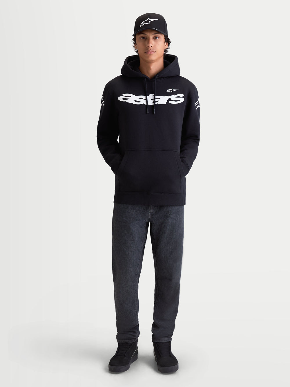 Alpinestars Velocifier Hoodie, Men's Black Pullover Fleece, Sportswear for Casual Off-Bike Wear, features White Astars wordmark on front and shoulder logos, premium cotton blend, shown on model with matching cap.