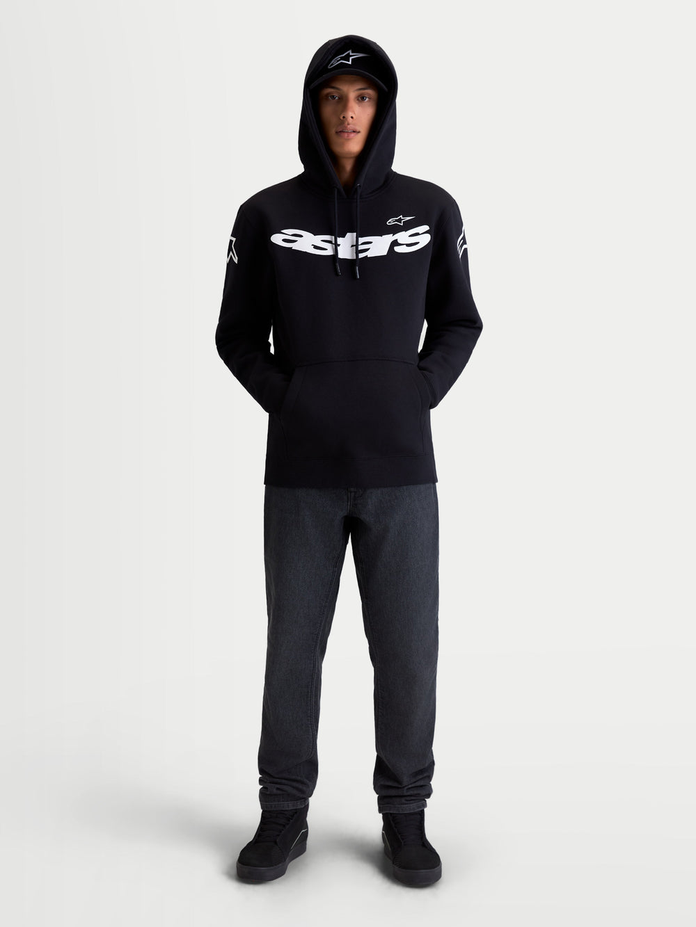 Alpinestars Velocifier Hoodie, Motorcycle Sportswear Pullover Fleece, Unisex, Black and White, Cotton and Recycled Polyester Blend, featuring bold Astars chest branding and shoulder logos, on-model front view for off-bike casual wear.