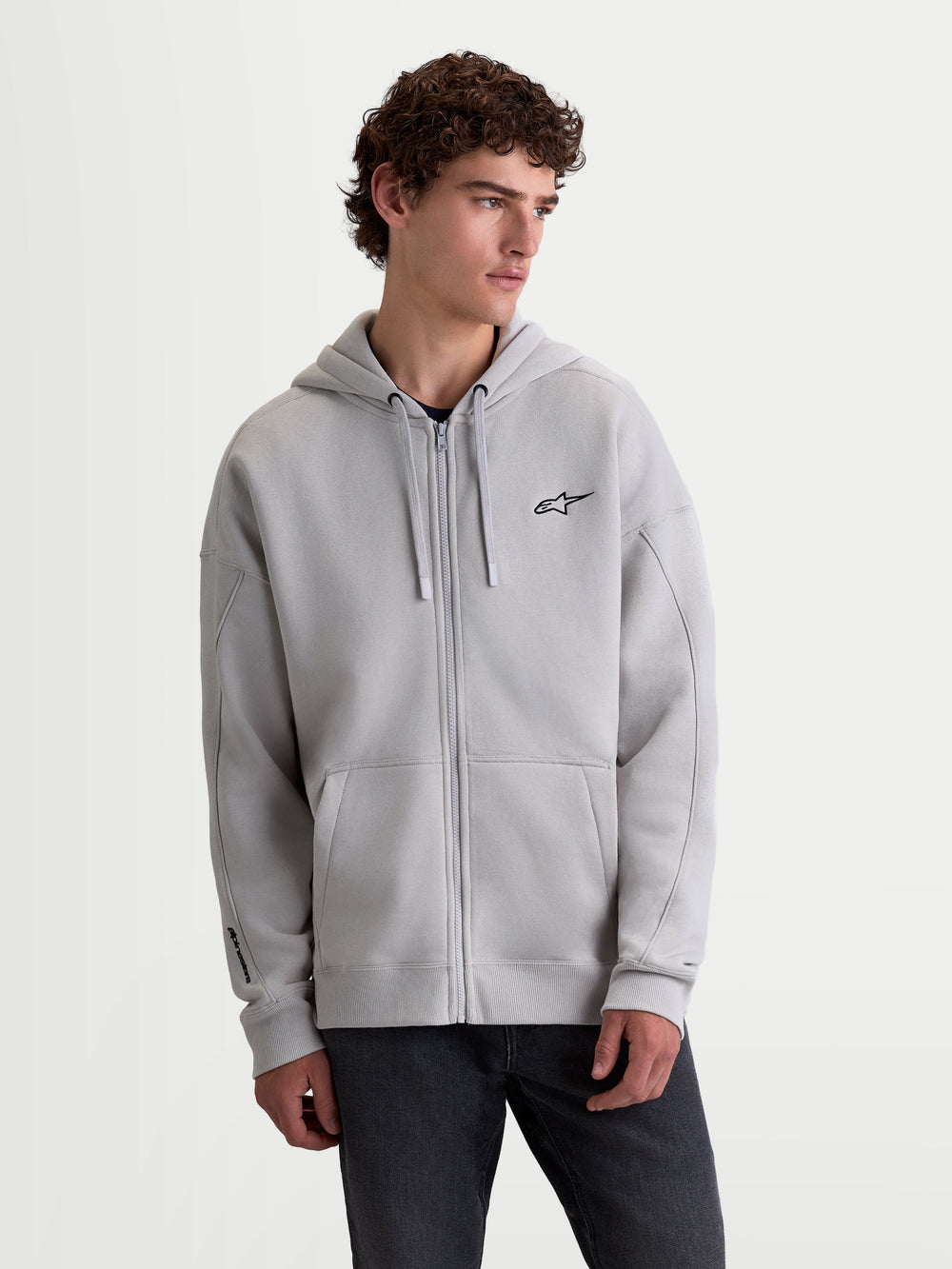 Alpinestars Entity Oversized Hoodie, Lifestyle Sportswear Zip Fleece, Unisex, Cement Gray, featuring a Vislon front zipper, kangaroo pocket, and embroidered Astars logo on the chest and sleeve, relaxed fit cotton blend construction.