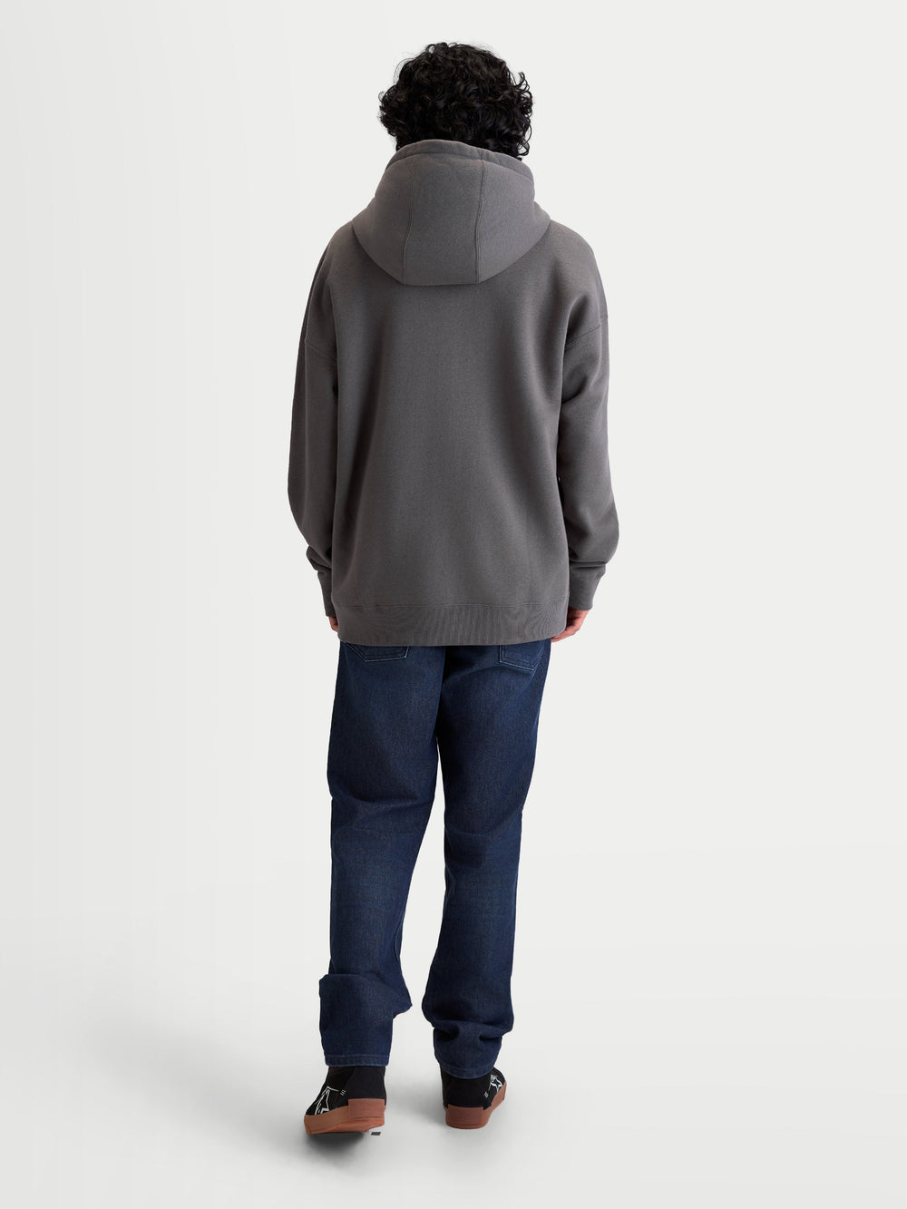 Alpinestars Entity Oversized Hoodie, Sportswear Zip-Up Fleece, Unisex, Charcoal Gray, Back View on Model showing Relaxed Fit, Self-Lined Hood, and Ribbed Cuffs, Cotton and Recycled Polyester Blend