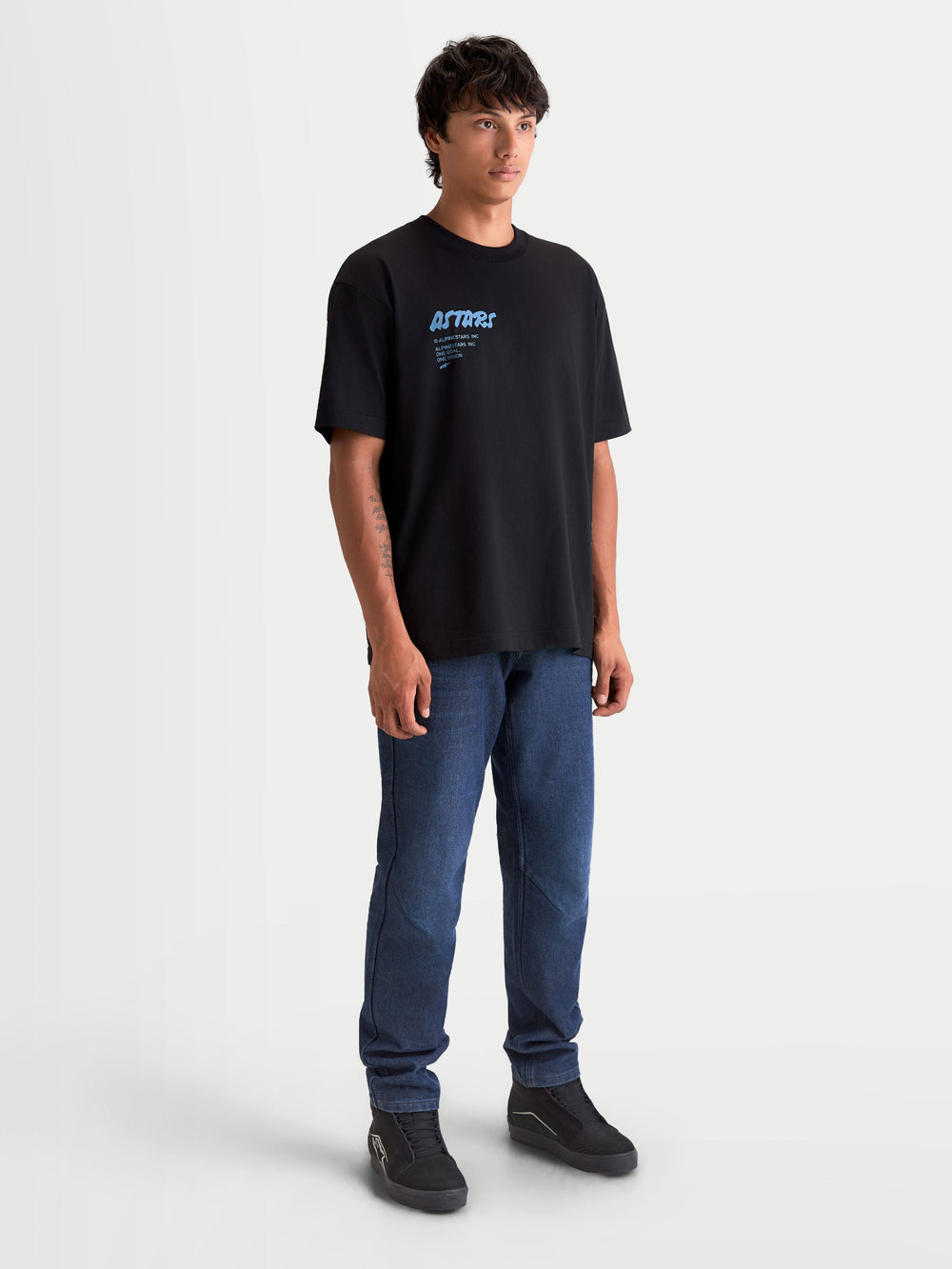 Alpinestars Chalk Oversized CSF Tee, Short Sleeve Sportswear T-Shirt, Men's, Black with light blue chalk-style Astars logo, Cotton and Polyester blend, featuring a relaxed oversized fit for a casual motorsport-inspired look.