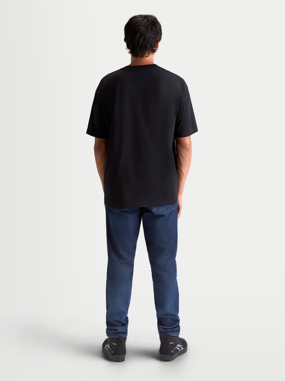 Alpinestars Chalk Oversized CSF Tee, black short sleeve sportswear t-shirt, back view on model showing the relaxed oversized fit and premium cotton-poly blend construction.