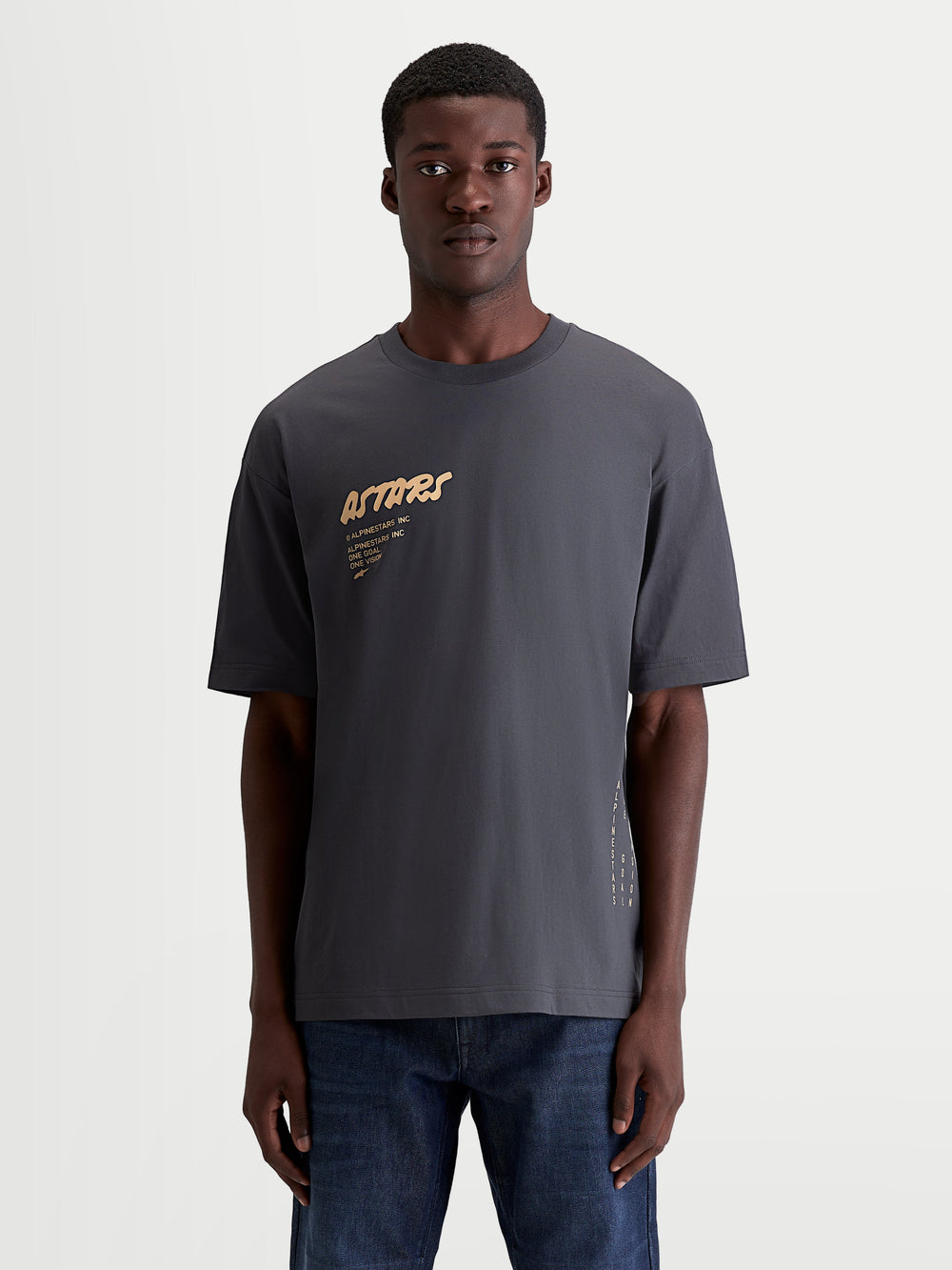 Alpinestars Chalk Oversized CSF Tee, Men's Short Sleeve Sportswear T-Shirt in Charcoal Gray, featuring a relaxed oversized silhouette, soft-hand Astars chest logo graphic in tan, and side text branding, cotton-poly blend.