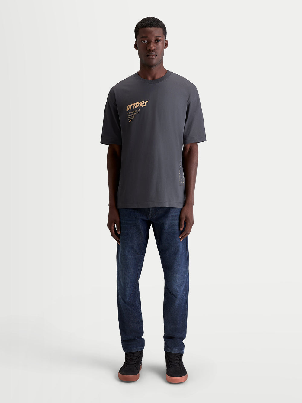 Alpinestars Chalk Oversized CSF Tee, Men's Sportswear Short Sleeve T-Shirt in Charcoal Gray with tan Astars front graphic, featuring a relaxed oversized fit and soft cotton-poly blend construction.