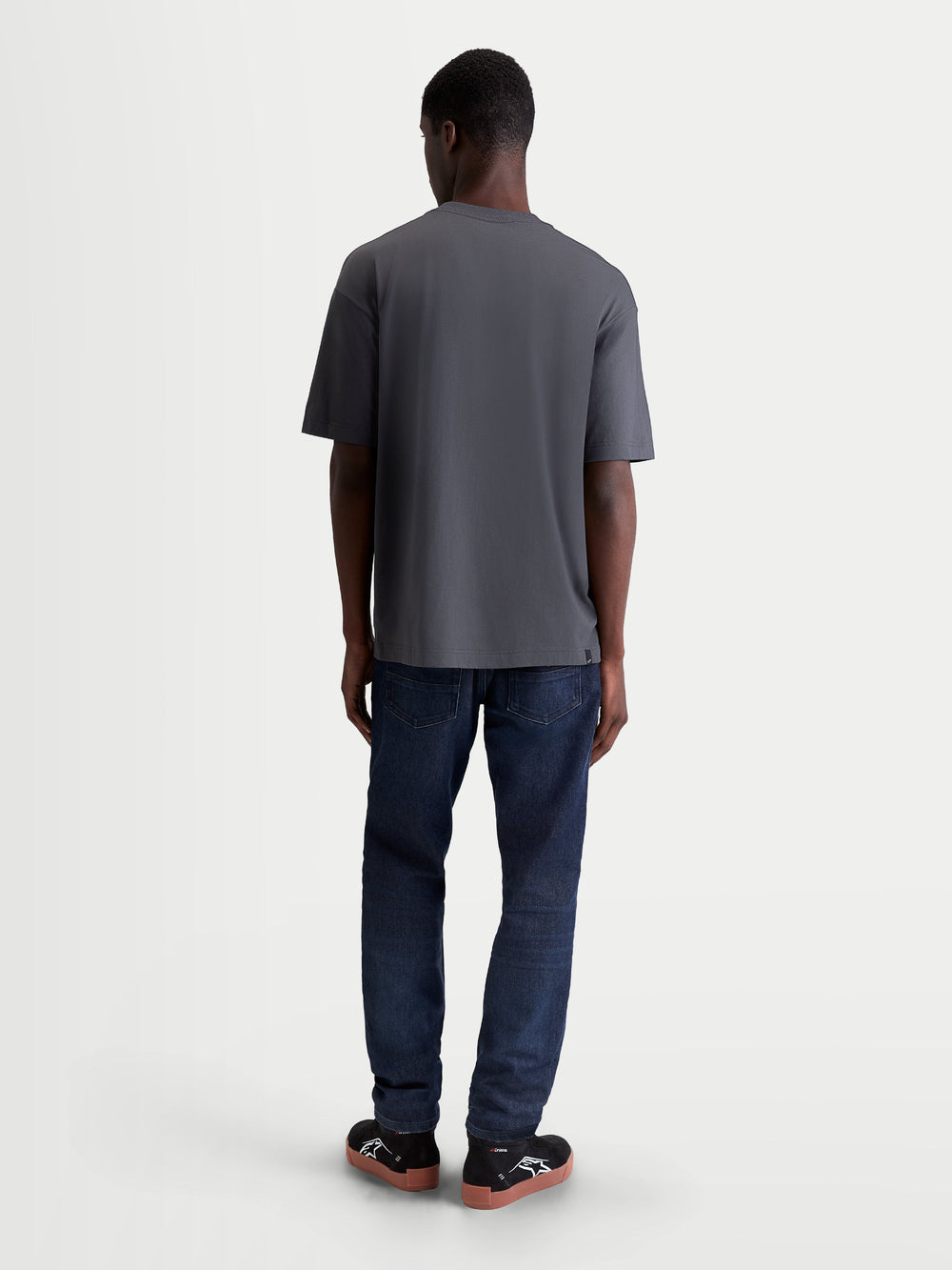 Alpinestars Chalk Oversized CSF Tee, Men's Relaxed Fit Sportswear T-shirt in Charcoal Gray, shown from the back on a model, everyday motorsport lifestyle apparel.