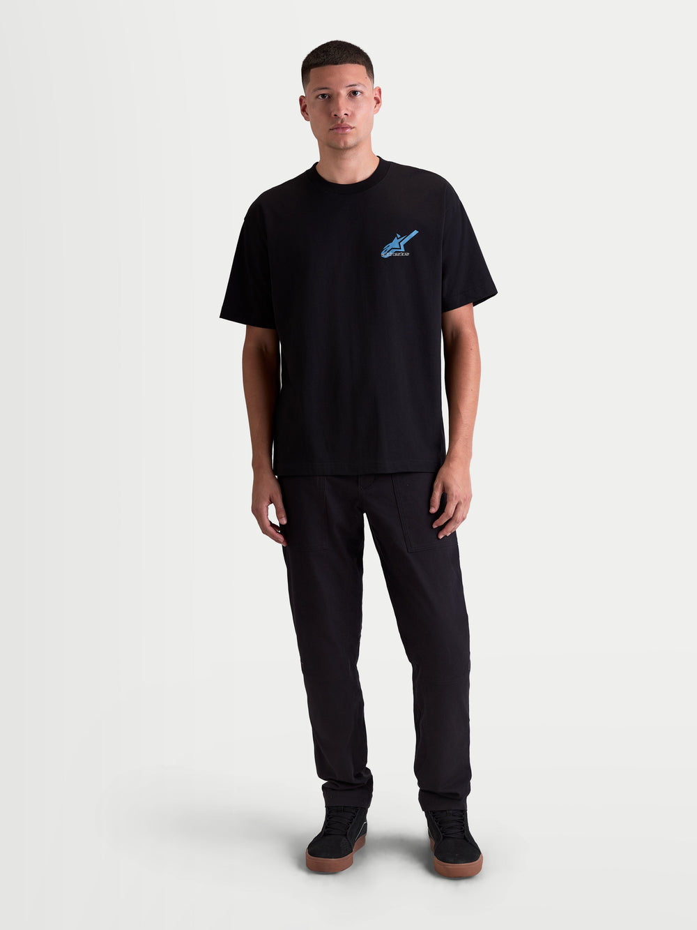 Alpinestars Ghost Oversized CSF Tee, Men's Short Sleeve Sportswear T-Shirt, Black with Blue logo graphic on the chest, relaxed oversized silhouette, 60/40 cotton-poly blend, casual motorsport-inspired lifestyle apparel.