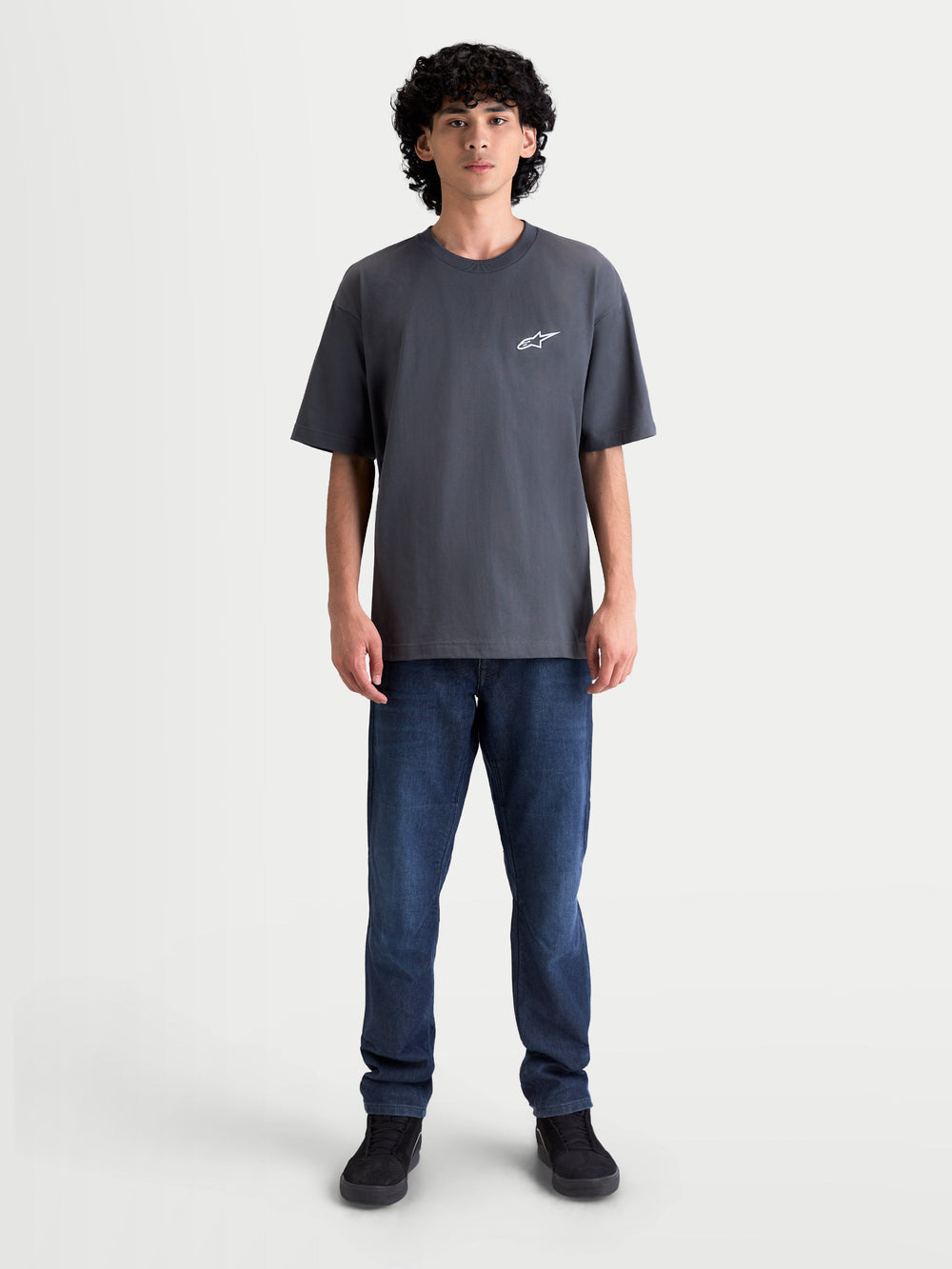 Alpinestars Mandate Oversized CSF Tee, Men's Short Sleeve Sportswear T-Shirt, Charcoal Gray, featuring a relaxed oversized fit and white puff-print Astars logo on the chest, premium cotton-poly blend, casual streetwear style.
