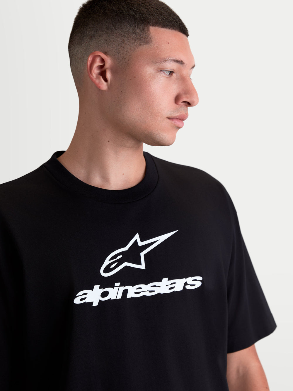 Alpinestars Prelude Oversized CSF Tee, Men's Sportswear Short Sleeve T-Shirt in Black, featuring white Astars stacked logo on the chest, relaxed oversized fit for casual comfort.