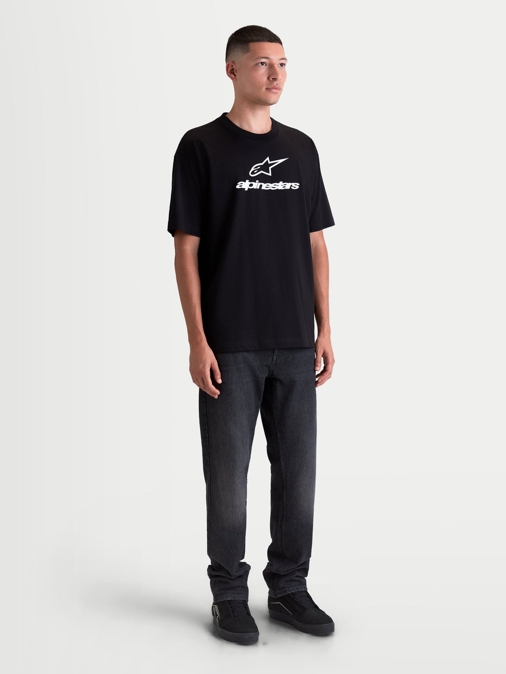 Alpinestars Prelude Oversized CSF Tee, Unisex Short Sleeve Sportswear T-Shirt in Black featuring a white front logo, relaxed oversized fit for casual comfort, cotton-poly blend.