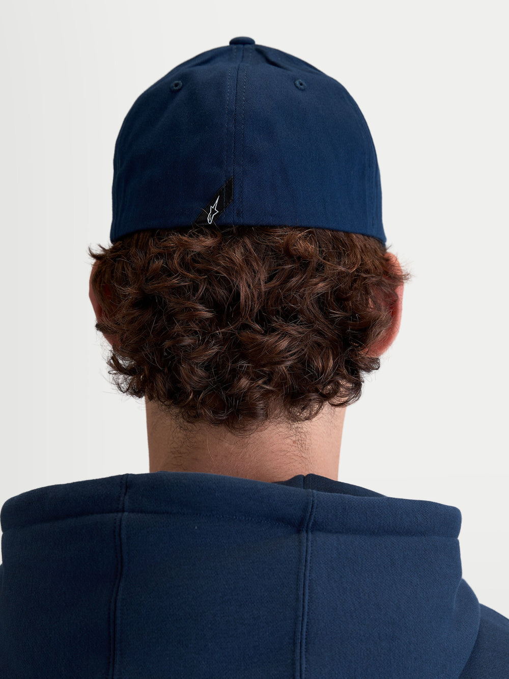 Alpinestars Arclight Hat, Unisex Sportswear Baseball Cap, Navy Blue, Durable Cotton Twill with Flex Back, Rear View on Model showing signature Astars logo label detail.