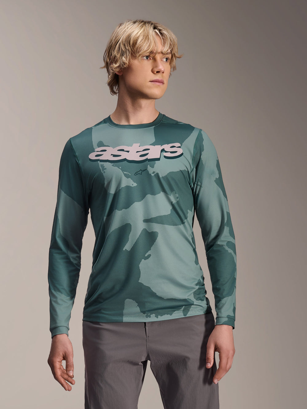 Alpinestars A-Dura Hollow Camo Long Sleeve Jersey, MTB Jersey, Silver Pine Camo green camouflage pattern, large light grey astars logo on chest, worn with grey pants, high-performance mountain biking apparel