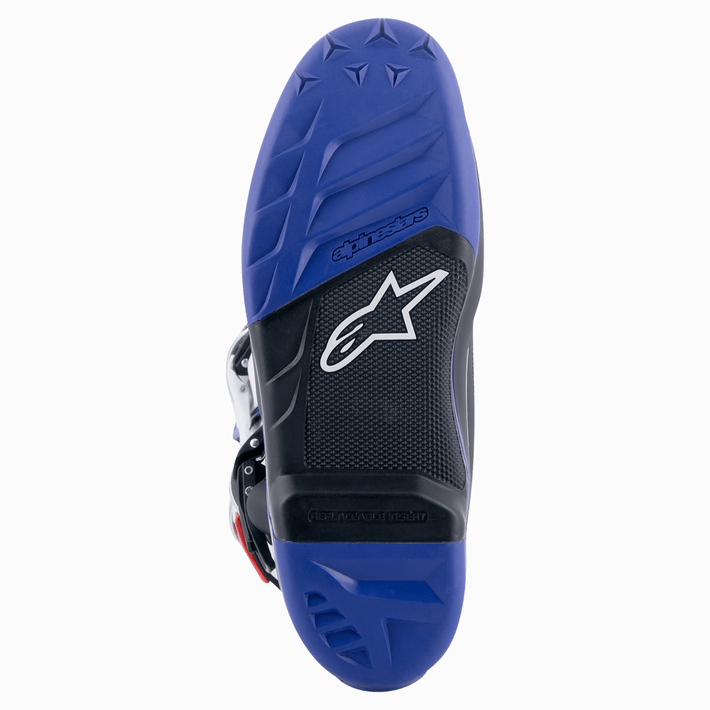 Alpinestars Tech 7 Boots, Motocross Boots, Black and Dark Blue, sole view showing high-grip textured pattern, white star logo, and replaceable footpeg insert for off-road performance