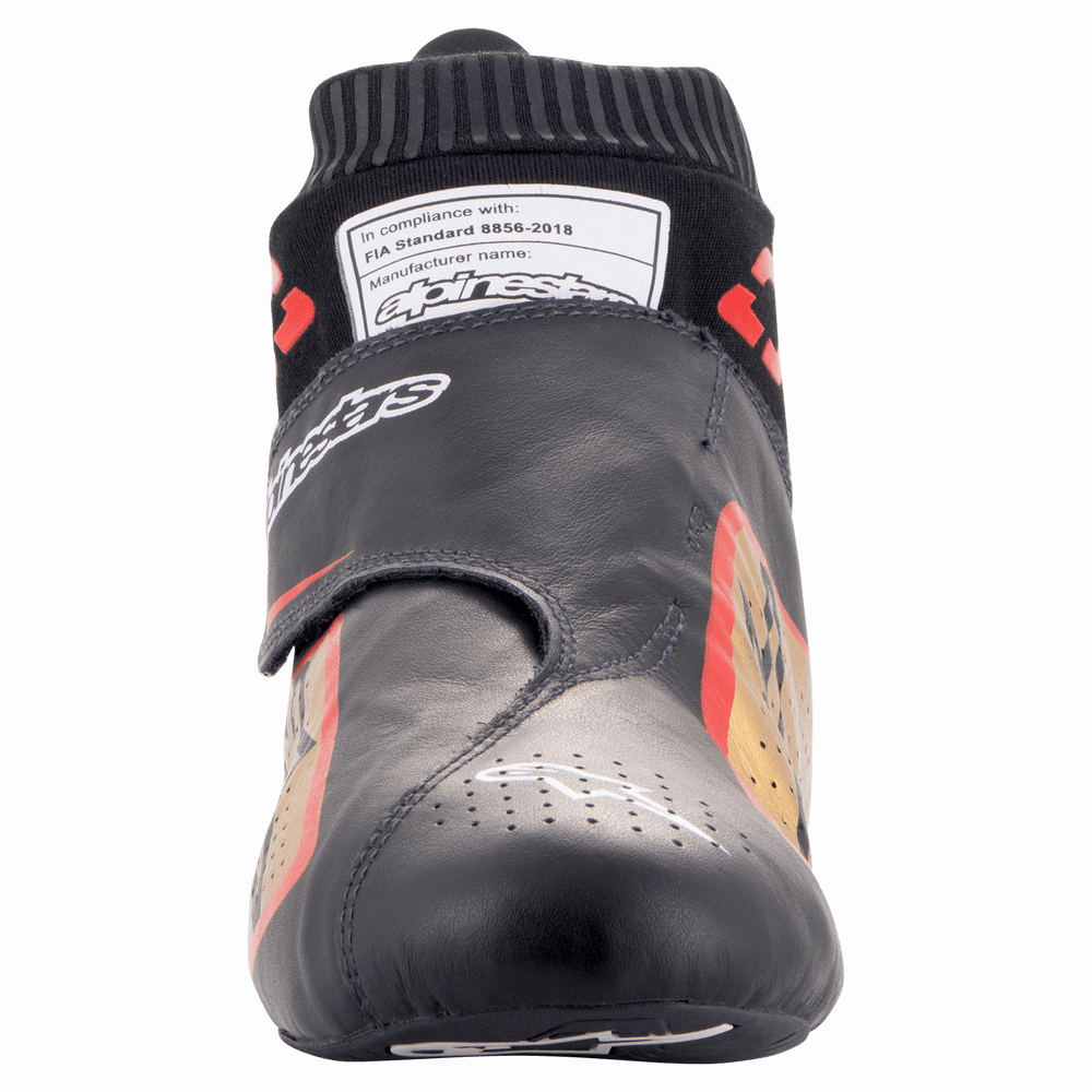 Alpinestars Supermono V2 Shoes FIA, Auto Racing Shoes, Black Gold and Red, front view showing the sleek one-piece leather upper, perforated toe, and fireproof sock collar with FIA 8856-2018 homologation label