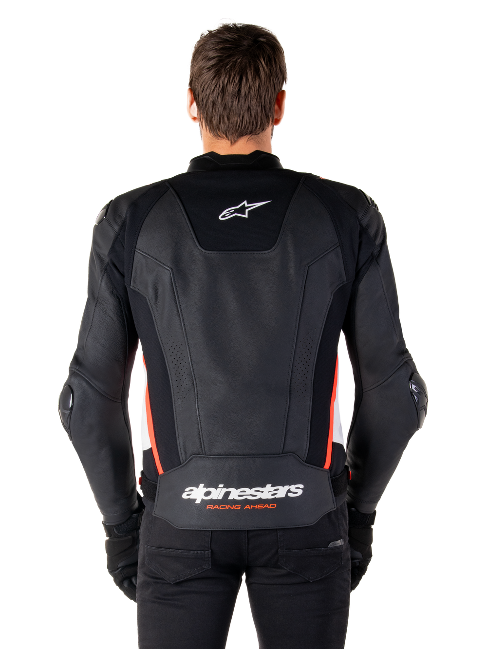 Alpinestars Missile V3 Leather Jacket, back view, premium black leather with red fluo and white accents, featuring a white star logo on the upper back and Alpinestars branding on the lower back, worn with black pants and gloves.
