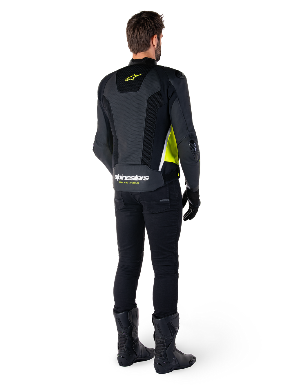 Alpinestars Missile V3 Airflow Leather Jacket, Black Yellow Fluo White, rear view on rider, featuring perforated leather back panels, yellow Alpinestars logo, and white accents, worn with black riding pants and boots