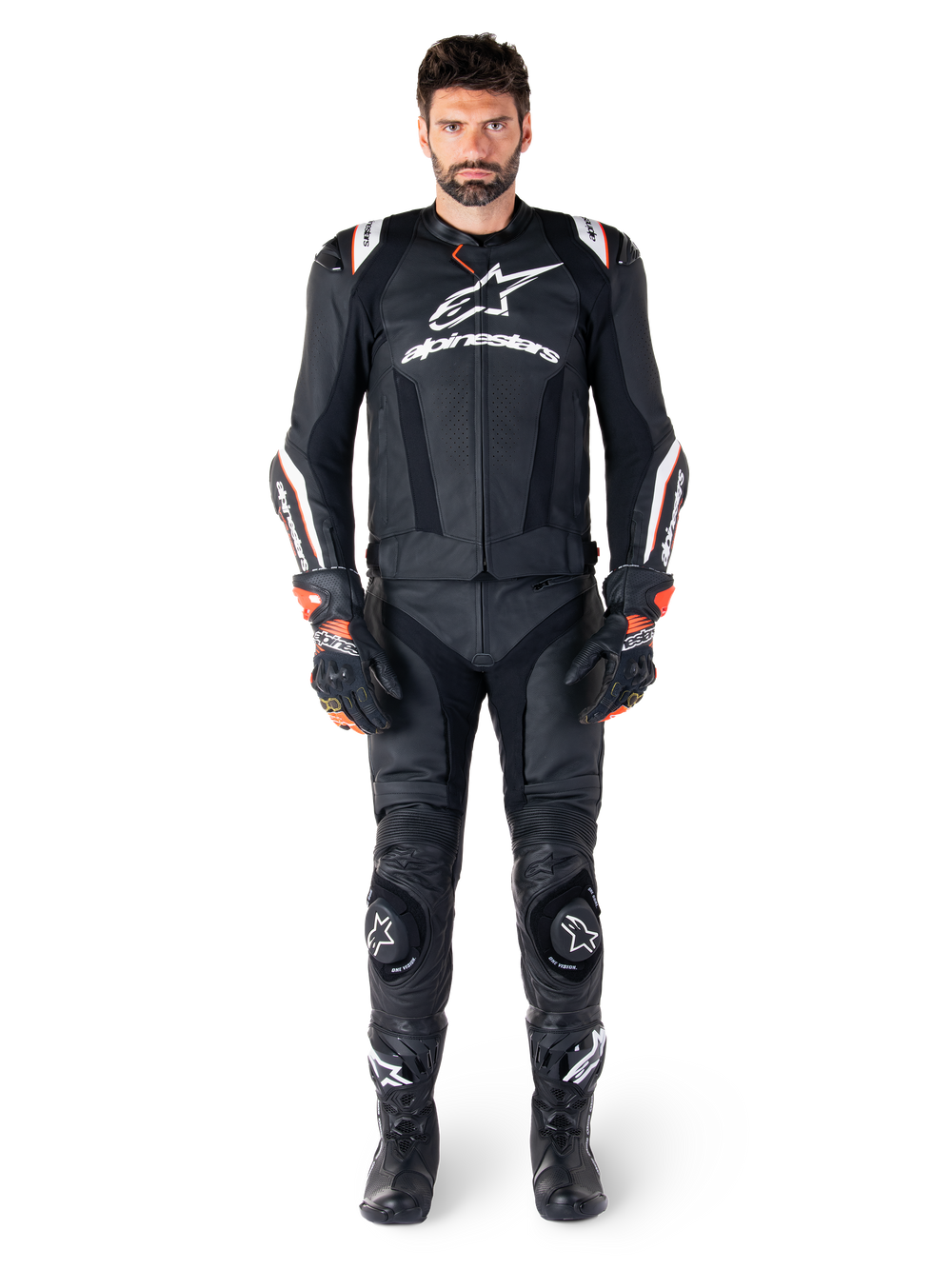 Male rider wearing the Alpinestars Missile V3 Ignition Leather Jacket in Black, paired with matching leather pants, gloves, and boots, featuring white Alpinestars branding and red accents, designed for professional racing performance.