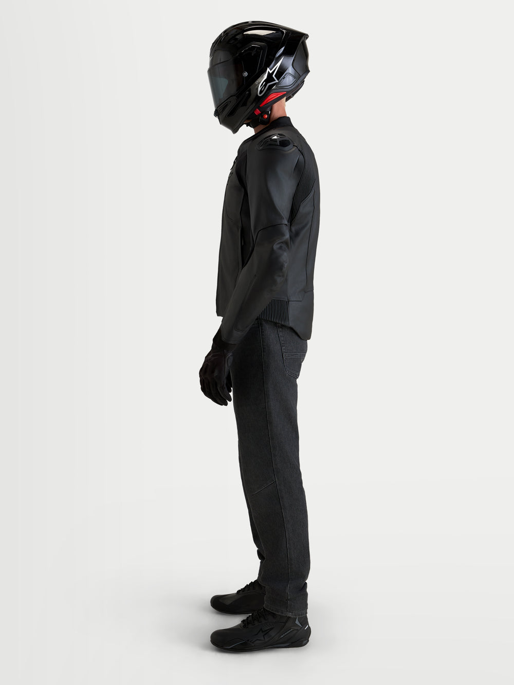 Alpinestars Caliber V2 Leather Jacket, Men's Black motorcycle leather jacket, featuring DFS armor shoulders and CE AA-rated protection, worn by a rider in profile view