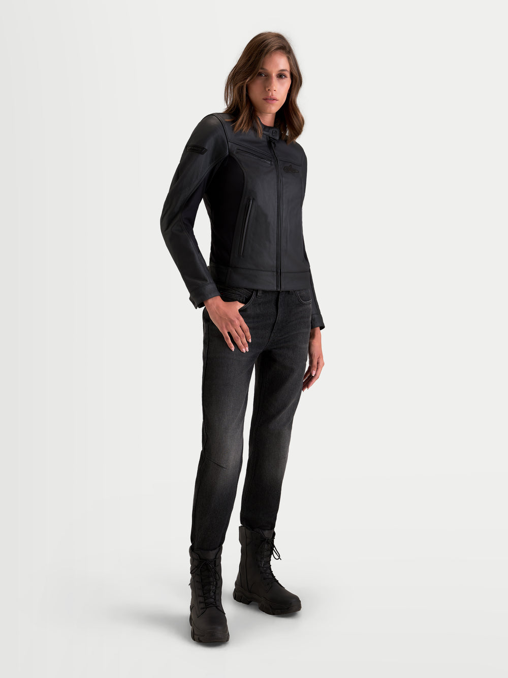 Alpinestars Stella Maver-X Leather Jacket, women's urban motorcycle leather jacket in black, on-model front three-quarter view showing premium bovine leather construction and tailored fit.
