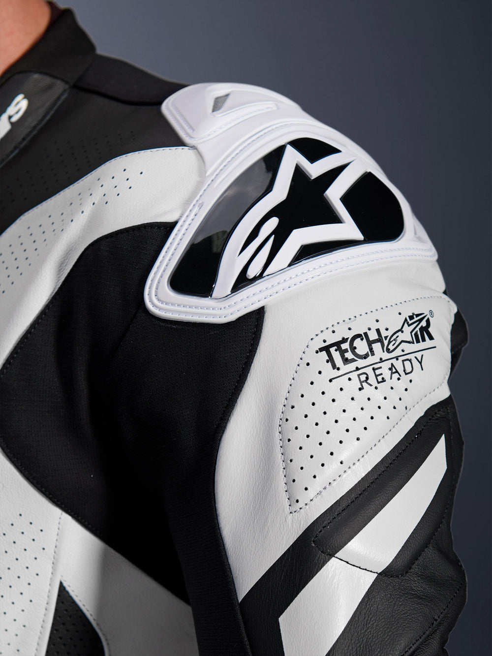 Alpinestars GP Plus V4 Sprint Leather Suit shoulder armor, black and white perforated leather with Tech-Air Ready logo.