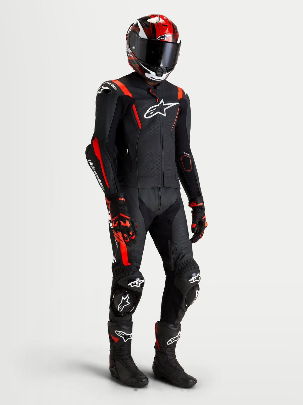 Alpinestars Missile V3 Leather Suit - 2 Piece, Black and Red Fluo men's motorcycle racing leather suit, AAA certified with protective armor and aerodynamic design, worn on model with matching helmet, gloves, and boots
