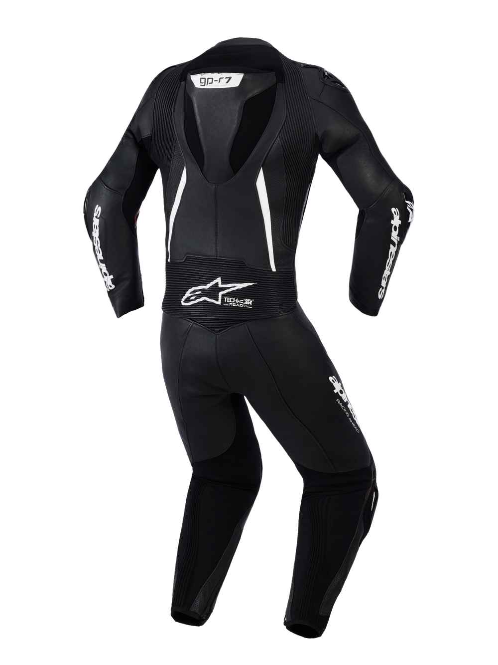 Alpinestars Woman Stella GP-R7 2-Piece Leather Suit, back view in Black with white accents, featuring an integrated aerodynamic hump, accordion stretch panels on shoulders and lower back, perforated leather for ventilation, and prominent Alpinestars branding.