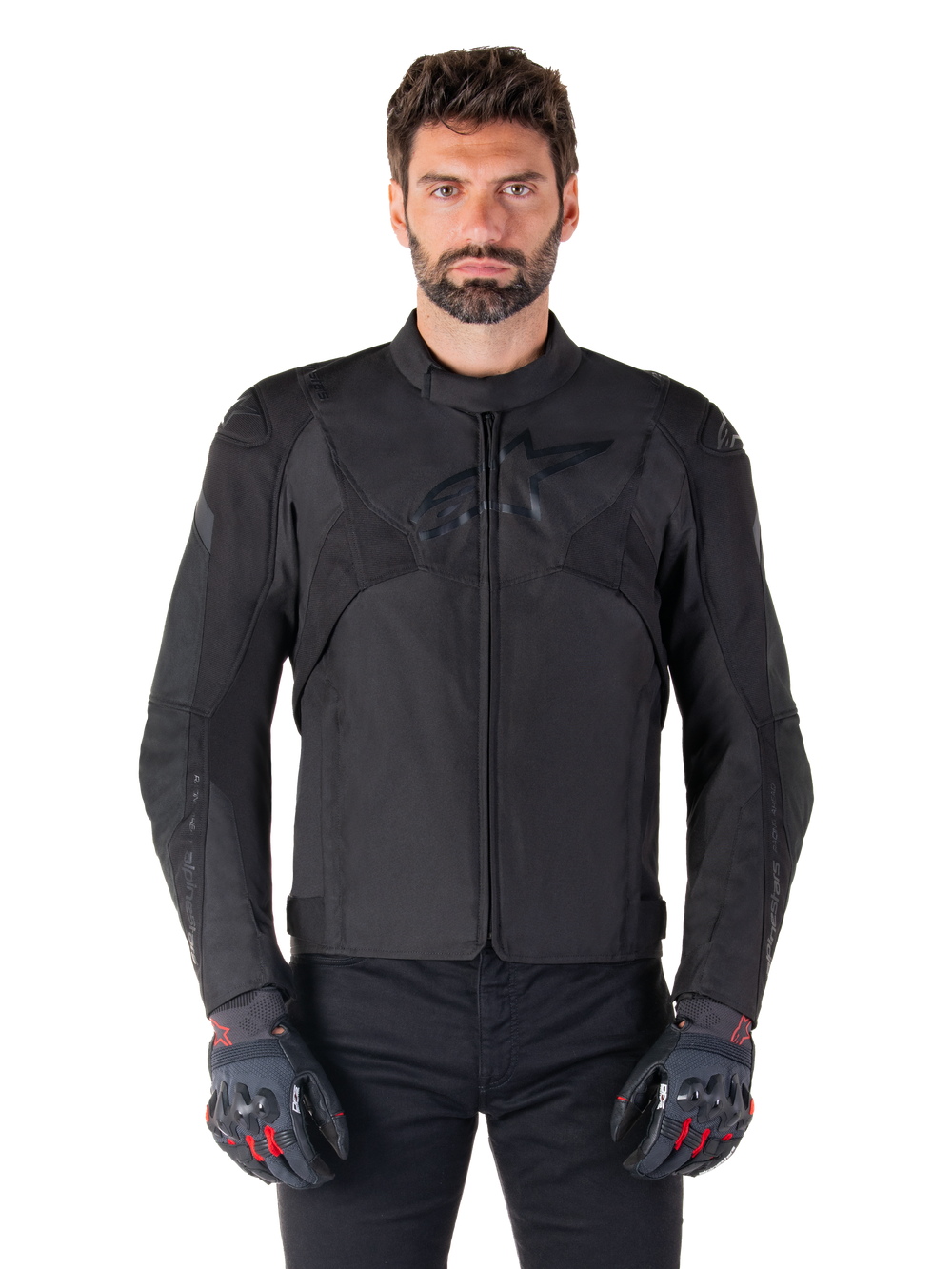 Alpinestars T-Jaws V4 Waterproof Jacket, Black Motorcycle Sport Jacket, worn by a man with black gloves featuring red accents, reinforced shoulders and arms, sleek design with subtle chest logo, textile all-weather riding gear