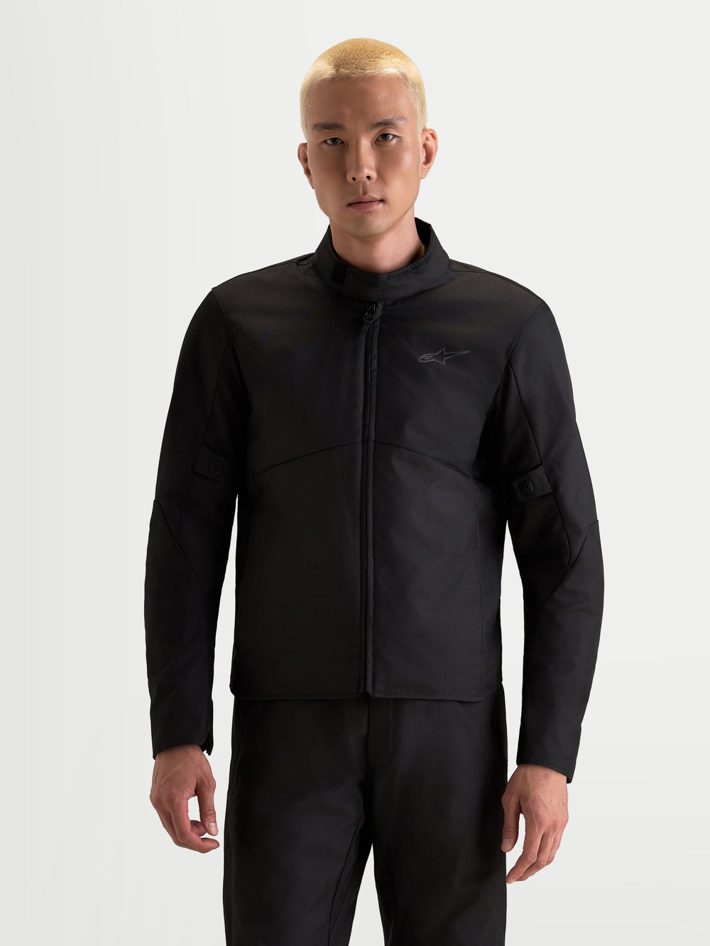 Alpinestars C-1 Waterproof Jacket, men's urban motorcycle jacket in black, front view worn by a model showcasing waterproof textile construction and high collar.