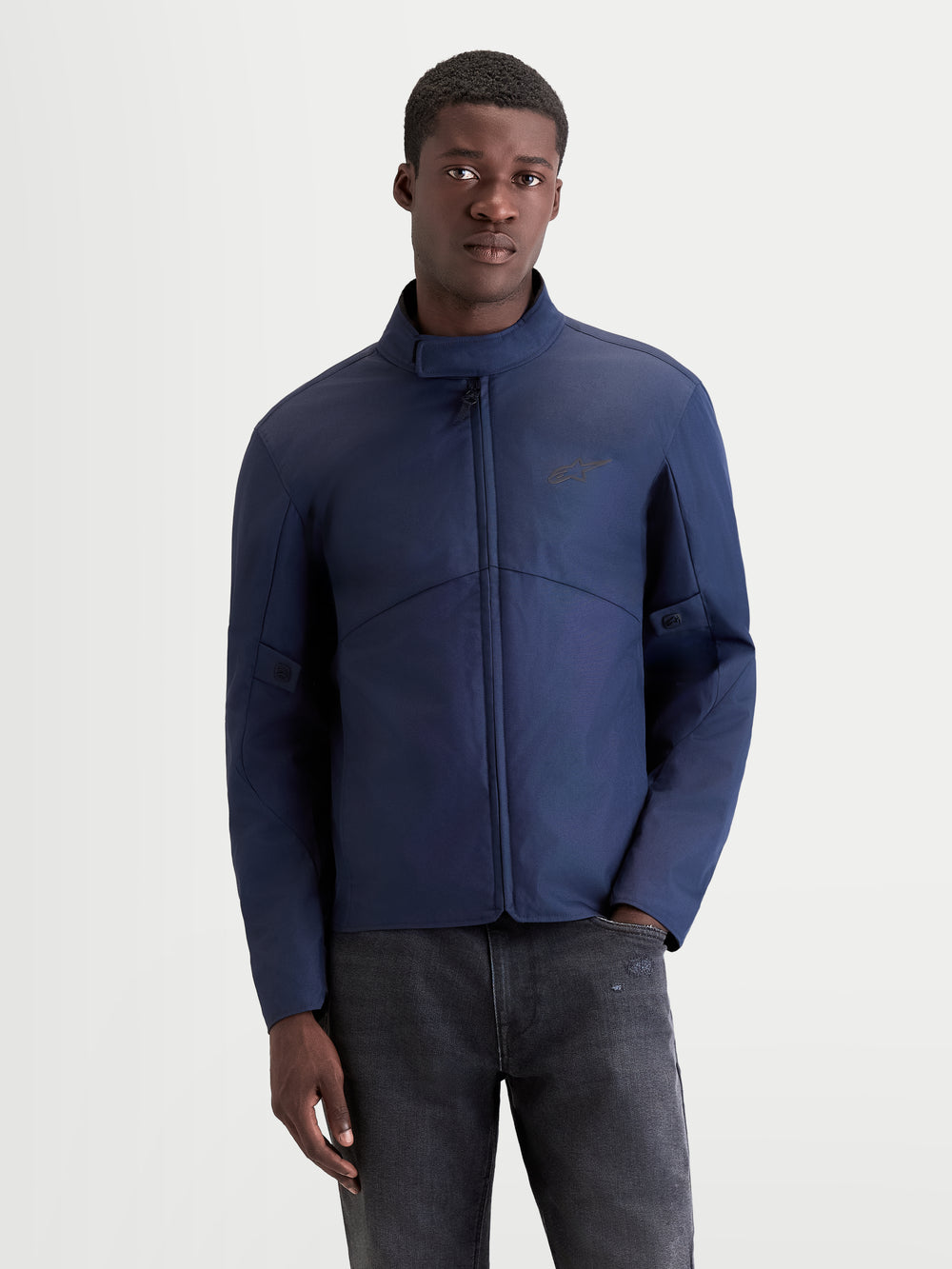 Alpinestars C-1 Waterproof Jacket, men's urban contemporary motorcycle textile jacket in dark blue, front view worn by a model showing waterproof construction and soft-finish collar