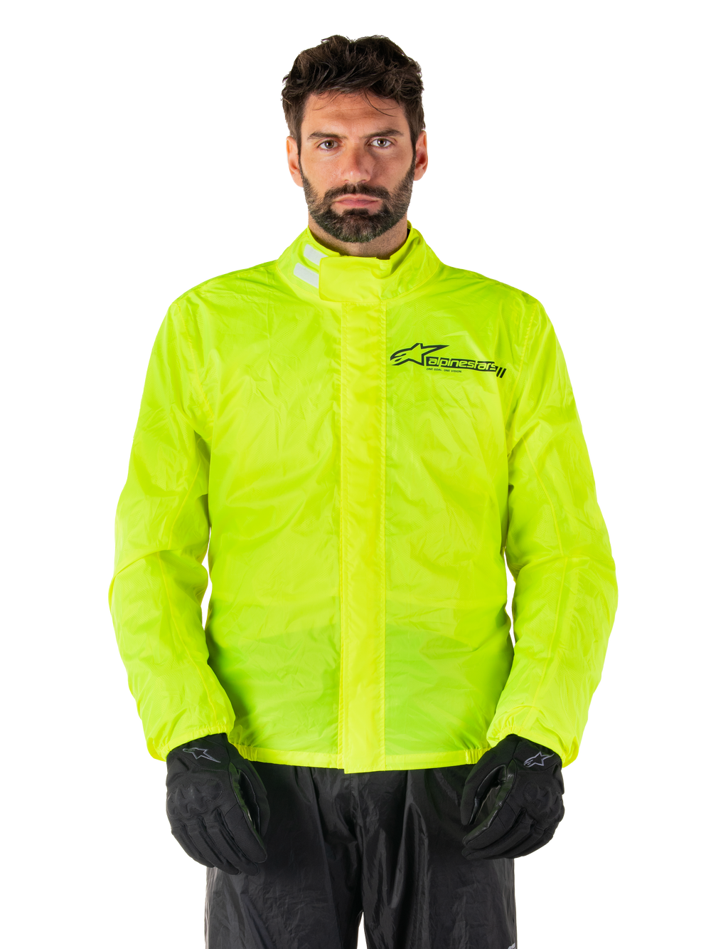 Alpinestars Hurricane Rain V2 Jacket, Motorcycle Rain Jacket, Yellow Fluo, worn by a model with black pants and gloves, high collar with reflective tabs, front storm flap with Alpinestars logo, high-visibility waterproof gear