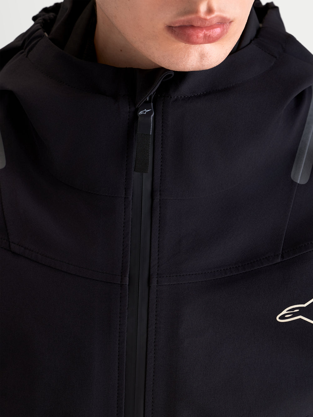 Alpinestars C-7 Drystar®XF Jacket, men's urban contemporary motorcycle jacket in black, close-up view highlighting the waterproof laminated textile construction, integrated hood, and high collar worn by a model