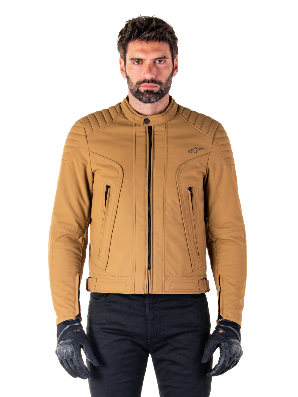 Alpinestars Clayton WR Jacket, Urban Motorcycle Jacket, Utility Brown Light Gold, water-resistant textile with quilted padded shoulders, high biker collar, black zipper details, and chest logo, worn with black protective gloves and pants