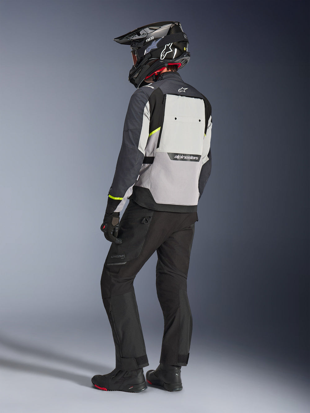 Alpinestars Cusco Drystar® Jacket, men's adventure touring motorcycle jacket in ice gray, mid gray, and deep gray, back view showing large ventilation panel worn by a rider.