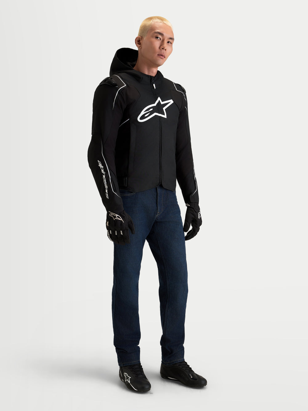 Alpinestars Zaca V2 Waterproof Jacket, Men's Black and White motorcycle racing jacket, worn by a model with DFS shoulder armor and waterproof textile construction