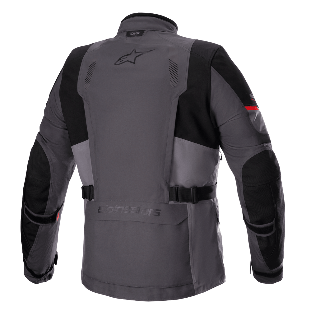 Alpinestars Monteira Drystar® XF Jacket, Adventure Touring Motorcycle Jacket, Dark Gray and Tar Gray with Bright Red accents, back view showing rear utility pocket, waist straps, and reinforced black panels on shoulders and elbows, featuring the Astars logo on the upper back.