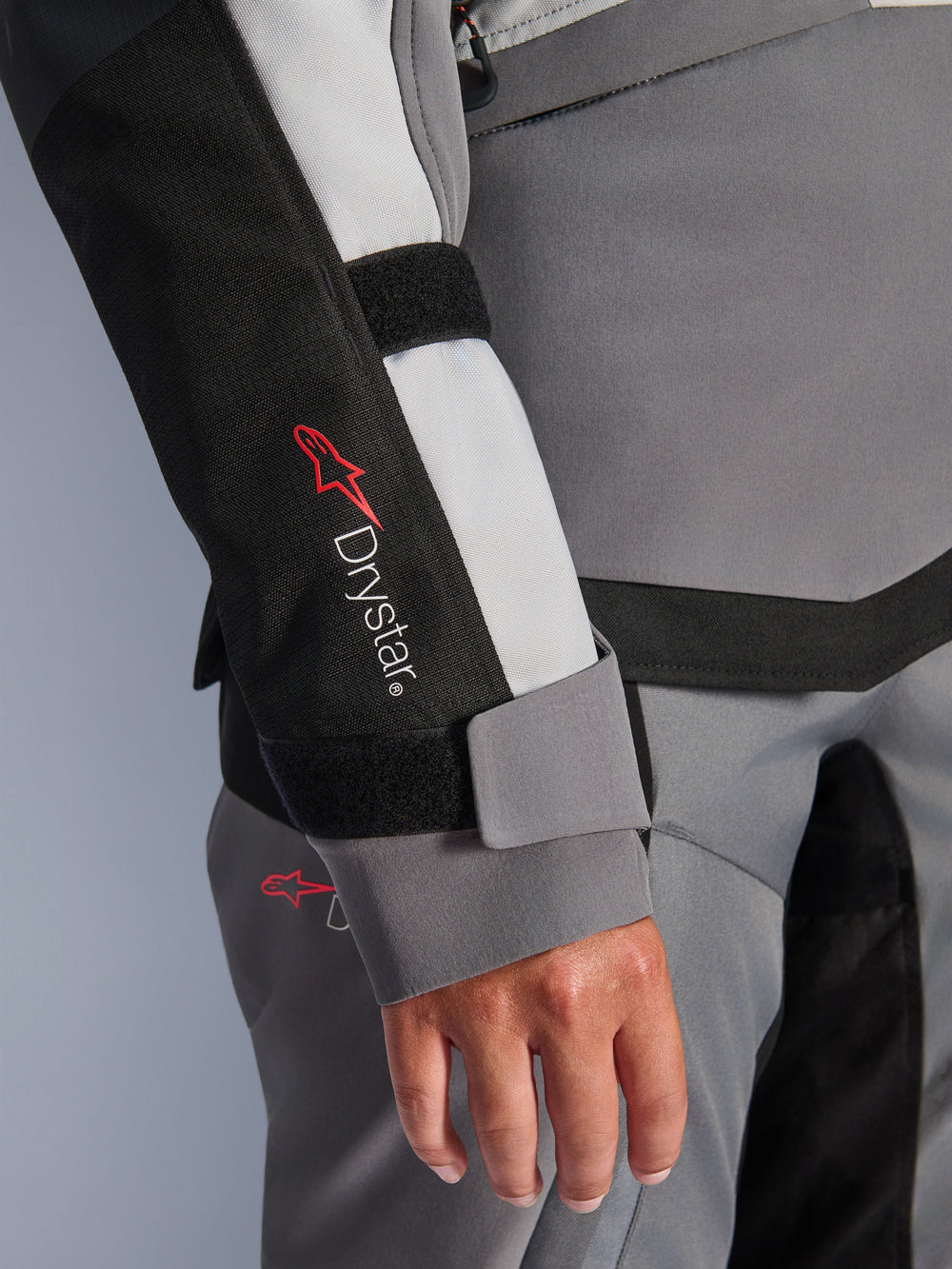 Alpinestars Stella Andes V4 Drystar® Jacket, women's gray textile adventure sleeve with logo and velcro wrist closure.