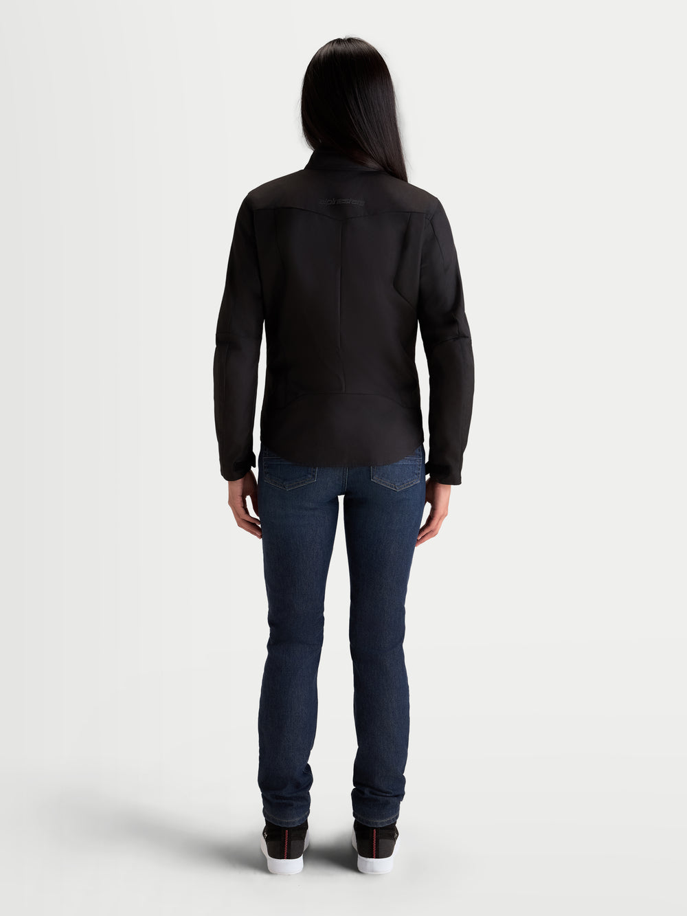 Alpinestars Stella C-1 Waterproof Jacket, women's urban motorcycle textile jacket, black, rear view showing ergonomic 3D back construction and waterproof 450D polyfabric shell worn by a model.