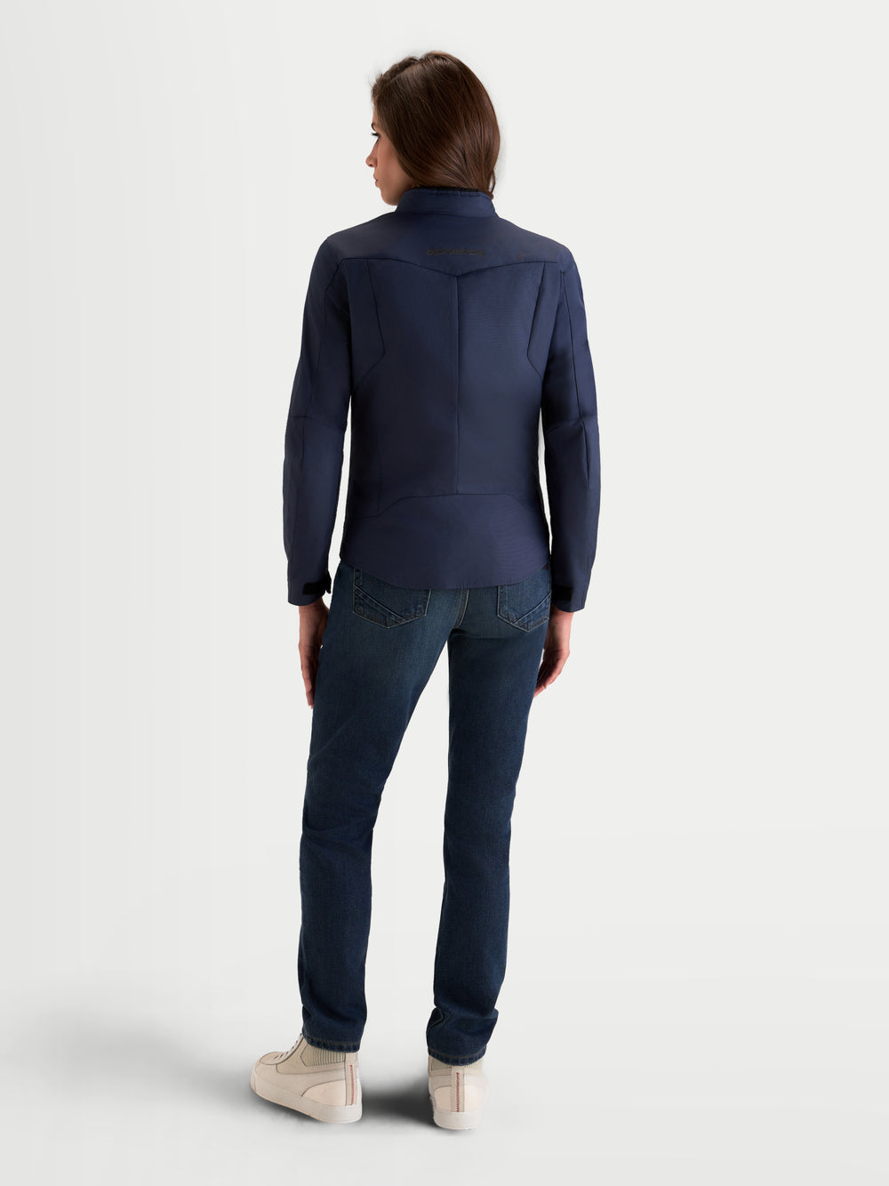Alpinestars Stella C-1 Waterproof Jacket, women's urban motorcycle textile jacket in mood indigo, rear view showing 3D back construction and waterproof riding apparel worn by a model.